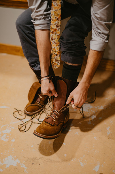 Hands tying boots