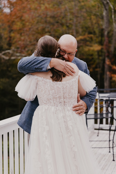 A dad and daughter hugging
