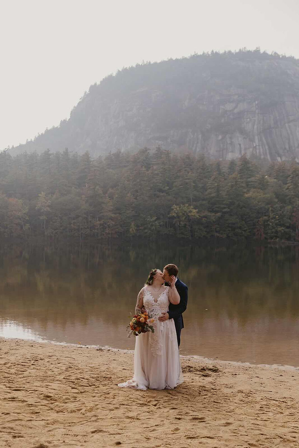 A couple kissing outside