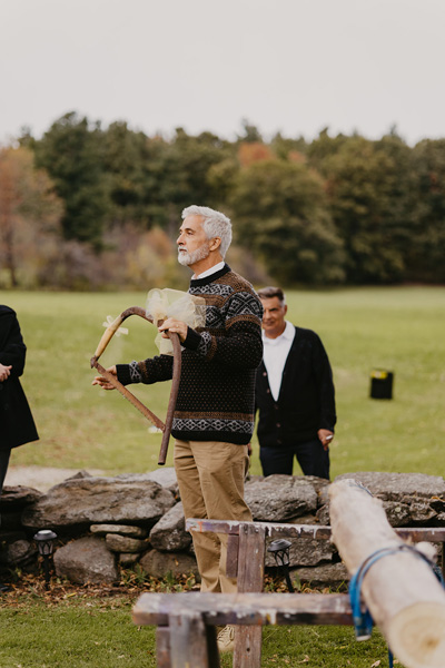 A father holding a saw