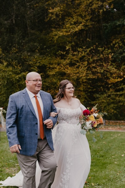A bride and father walking
