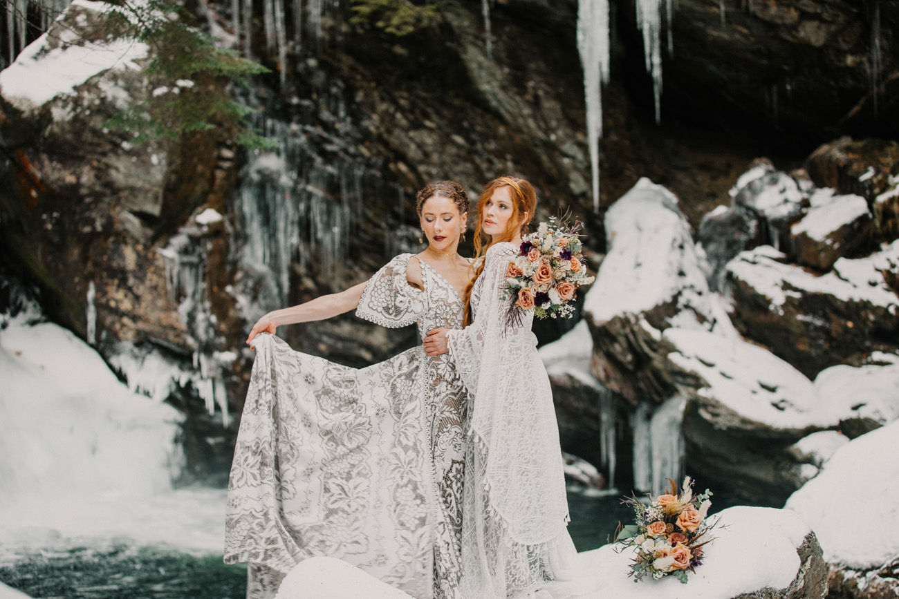 A couple posing at a waterfall