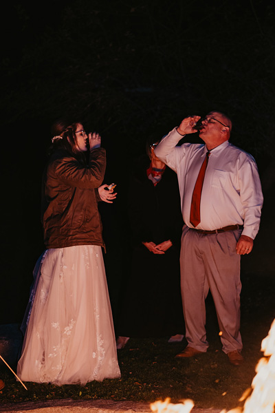 A couple and family at a fire