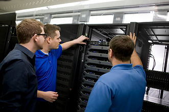 Technicians working on network wiring