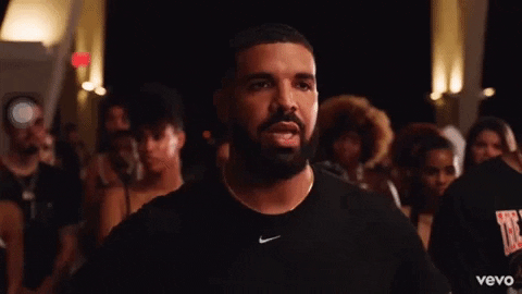 Drake making silly hand gesture mocking someone