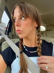 a girl wearing summer vibes rainbow seed bead necklace 