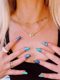 a girl wearing custom name initial necklace