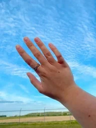 wearing criss cross checker board ring 