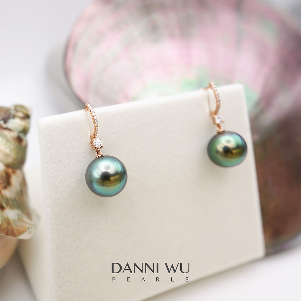 Thumbnail: natural tahitian pearl earrings with peacock overtone in 18K gold and natural diamonds
