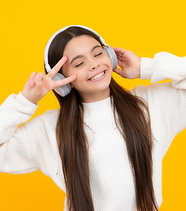 Child listening music with headphones Girl listening songs via wireless earphones Headset 