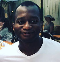 Alban smiling at camera