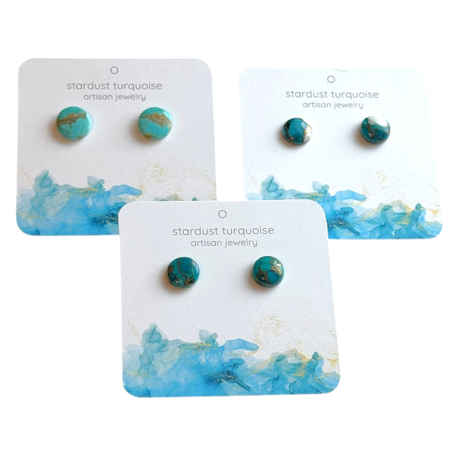 Three pairs of round blue turquoise stud earrings on decorative earring cards.