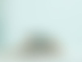 A stack of sterling silver rings, including one with a turquoise stone.