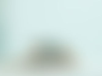 A stack of sterling silver rings, including one with a turquoise stone.