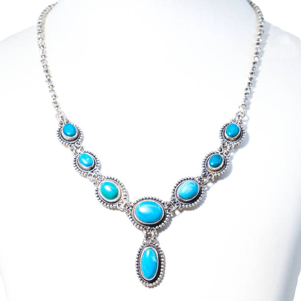 A sterling silver and turquoise lariat necklace