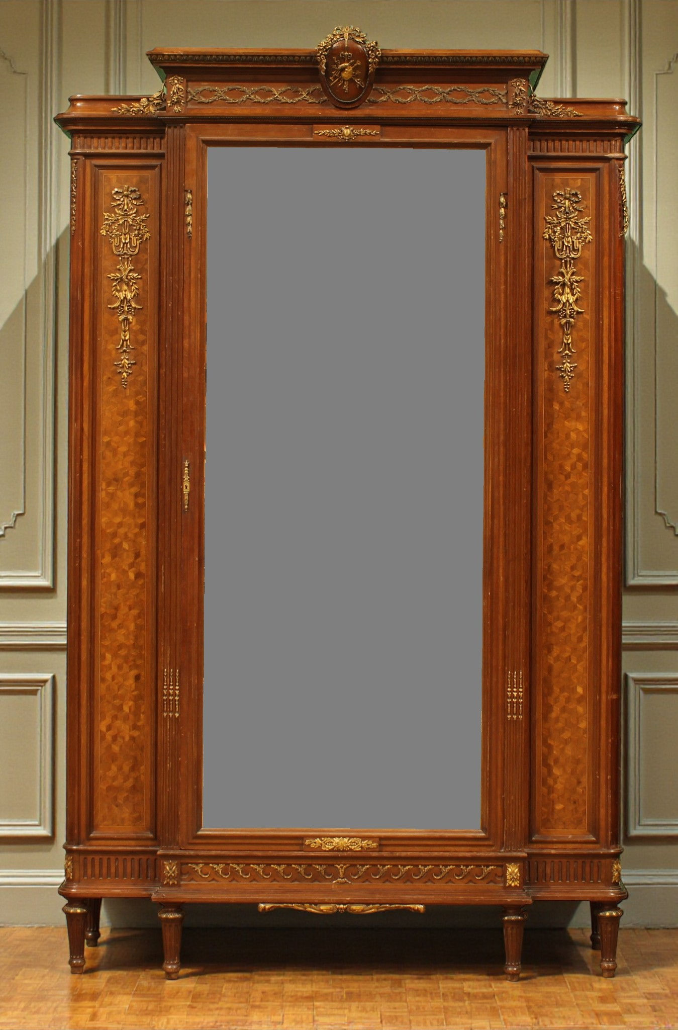 A Louis XVI Revival Gilt Mounted Mahogany and Block Parquetry Armoire Wardrobe