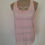 Miniature : Un mannequin porte un Débardeur rose en dentelle, pour seconde main.
