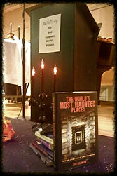 A candelabra and haunting books add a spooky touch to the Dead Composers Society Orchestra stage.