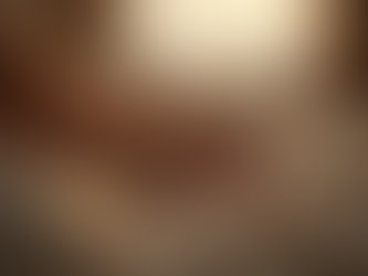 Hands holding on white sheets. The tone is warm and inviting. 