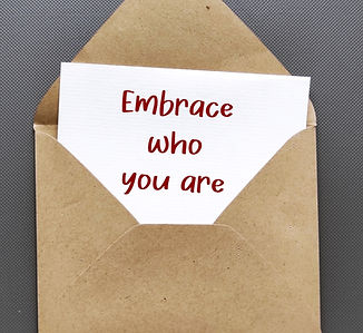 Envelope with handwritten text card EMBRACE WHO YOU ARE - journey of self-discovery and se