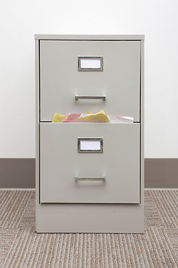 filing cabinet stuffed with papers.jpg