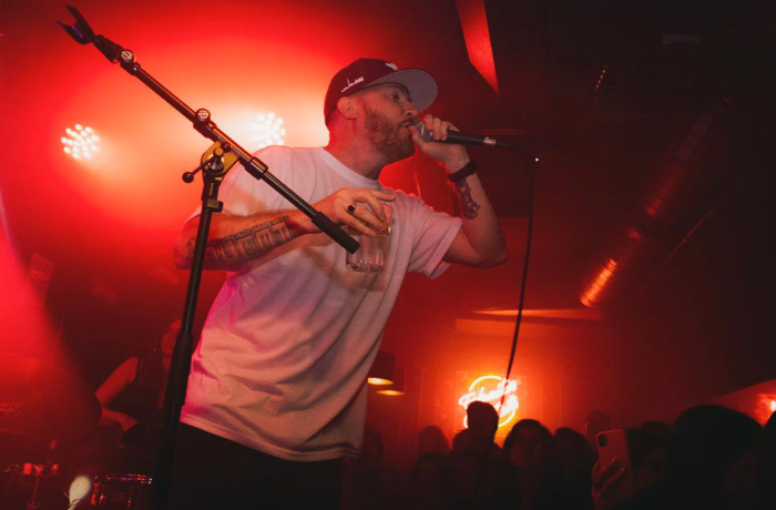 Rel McCoy performing — side angle