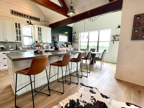 CoreTec flooring installed in the first story of a beautiful farmhouse style home featuring Sea Salt Oak with 9" planks and Soft Step attached underlayment.