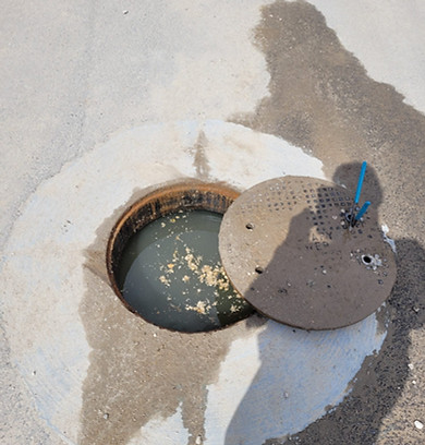manhole is full due to malfunctioning septic system