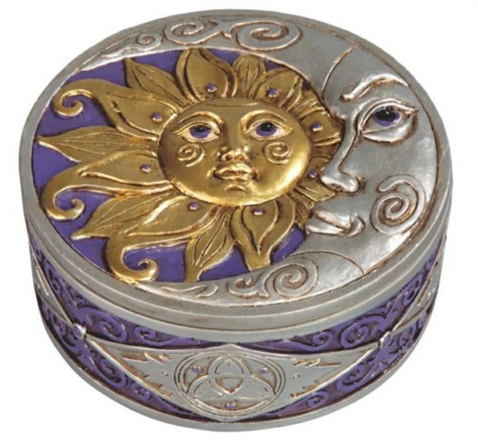 Round purple trinket box with raised sun and moon design, approximately 4 3/4 inches wide.