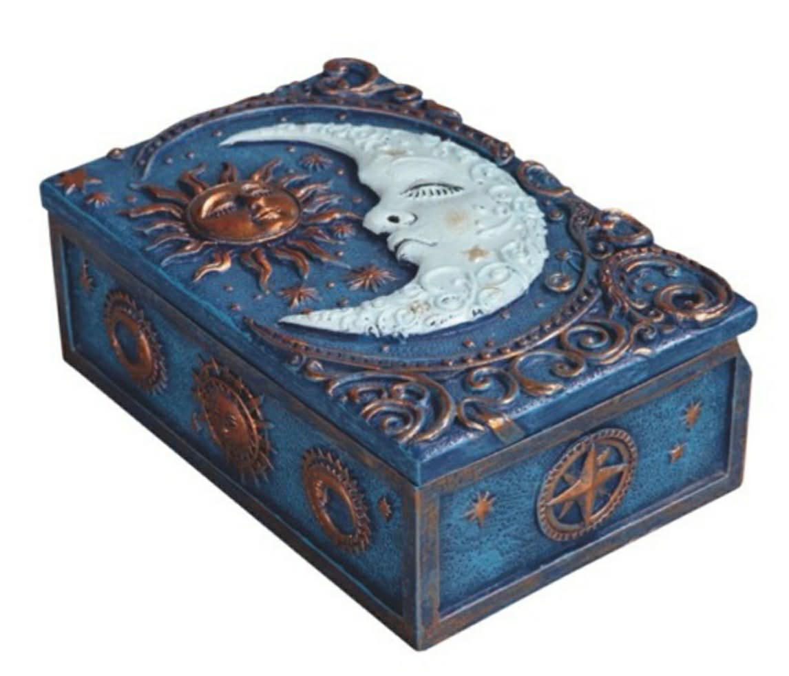 Blue rectangular trinket box with raised sun and moon design, approximately 5 3/4 inches long.
