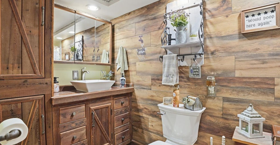 Half bathroom with vessel sink, wood vanity, and rustic wood-look wall design