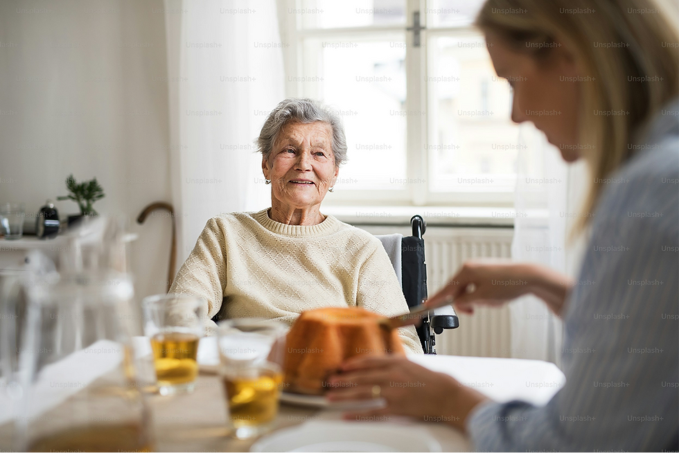 Smiling senior woman and companion cutting cake