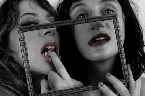 Two women with frame, black and white photo.