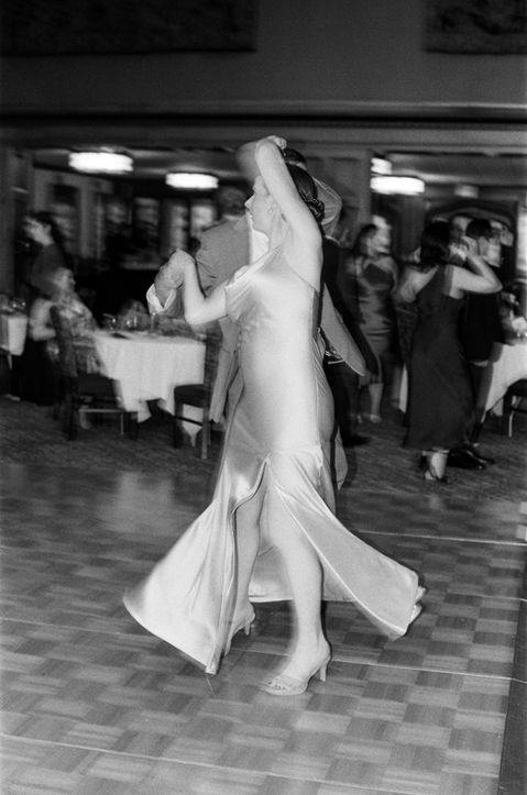 Black and white film photo of a wedding reception at the IMU's Tudor Room.