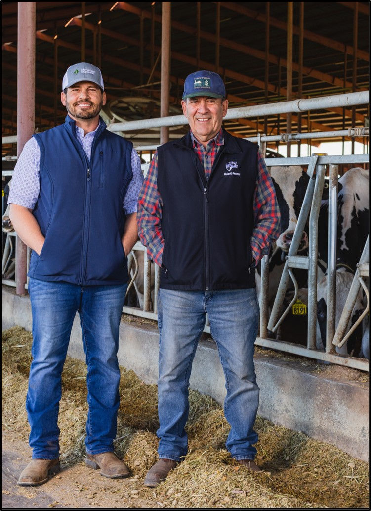 California dairy farmers pose in front of dairy barn