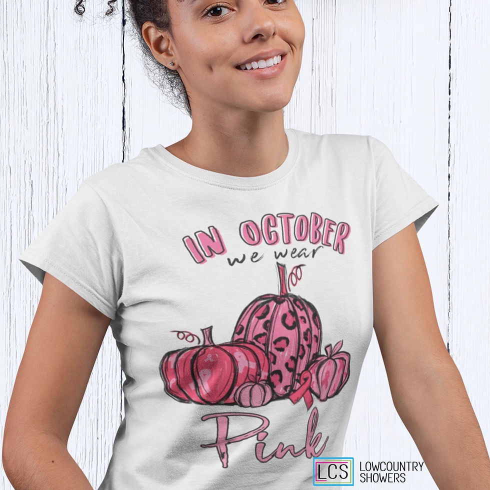 Woman wearing a white In October We Wear Pink Pumpkin Shirt with pink leopard print pumpkins and awareness ribbons.