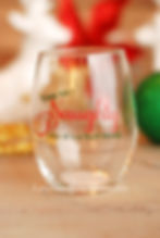 Stemless wine glass featuring the phrase "You Say Naughty Like It's a Bad Thing" in festive red and green lettering.