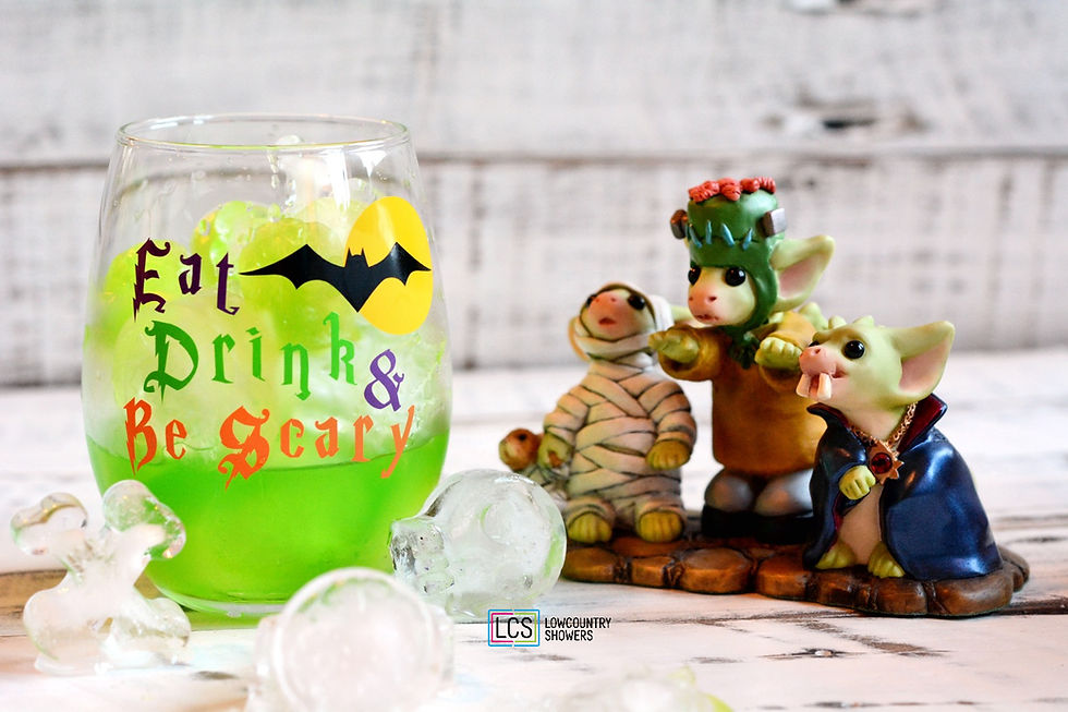 Stemless wine glass featuring the phrase "Eat Drink & Be Scary" with a flying bat and full moon Halloween design.