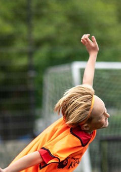 Soccer Schools player celebrates like an aeroplane