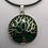 Thumbnail: Emerald Shadow Tree of Life Circle Pendant Necklace with Faux Leather Cord