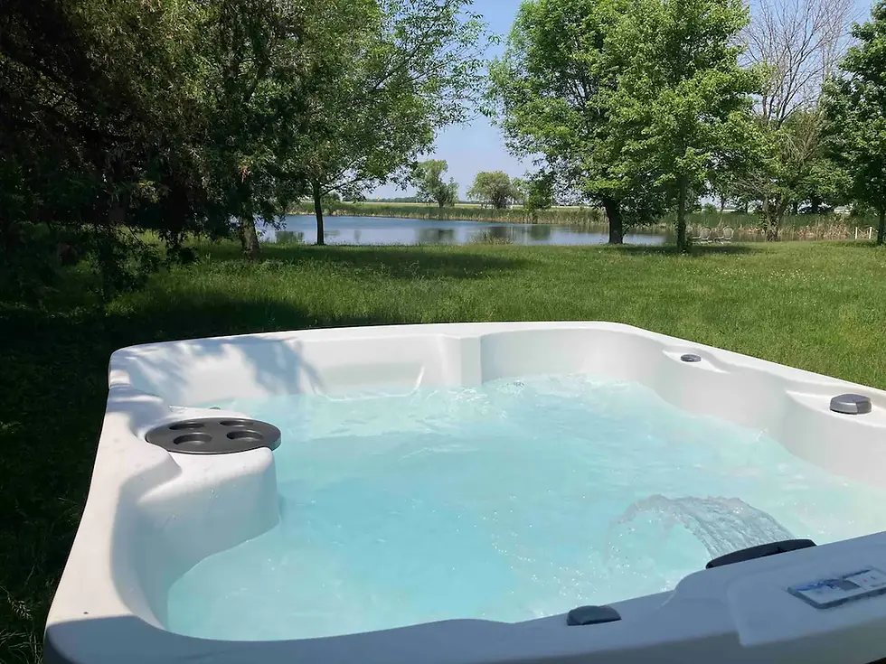 Outdoor hot tub surrounded by nature at Ujima Retreat Center, Urbana, IL.