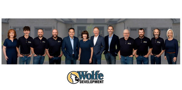 team composite photo of Wolfe Development in Jonesborough Tn owner Kelly Wolfe taken by Rebecca Griffin of London Vine Studios.