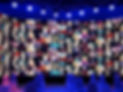 Blurred LED screen of many people faces