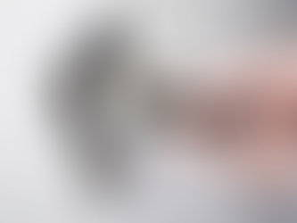 Close-up photo of a hand plugging in an electrical cord to an outlet.