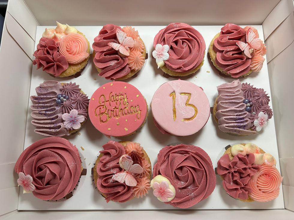 Thumbnail: Box of 12 cupcakes in vibrant shades of red and purple buttercream swirls, with 13th birthday theme