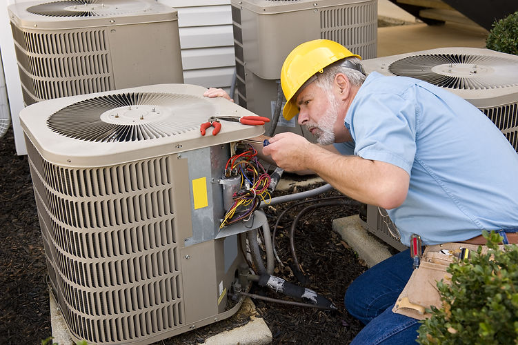 Repairman Works On Air Conditioner Horiz