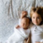 A Toddler and a Baby