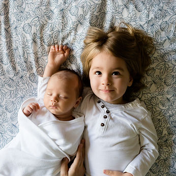 A Toddler and a Baby