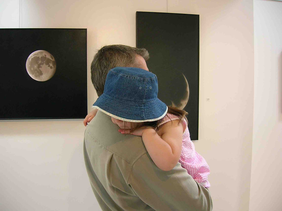 The gallery owner and his sleepy daughter. Time to go home.