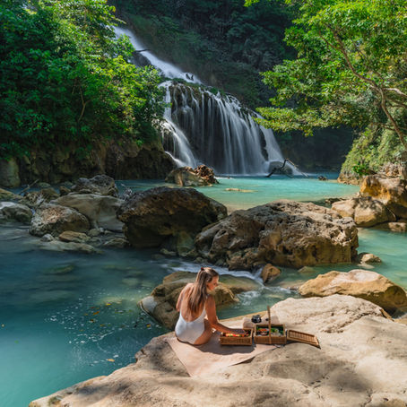 Woman enjoying breakfast picnic at NIHI Sumba Indonesia